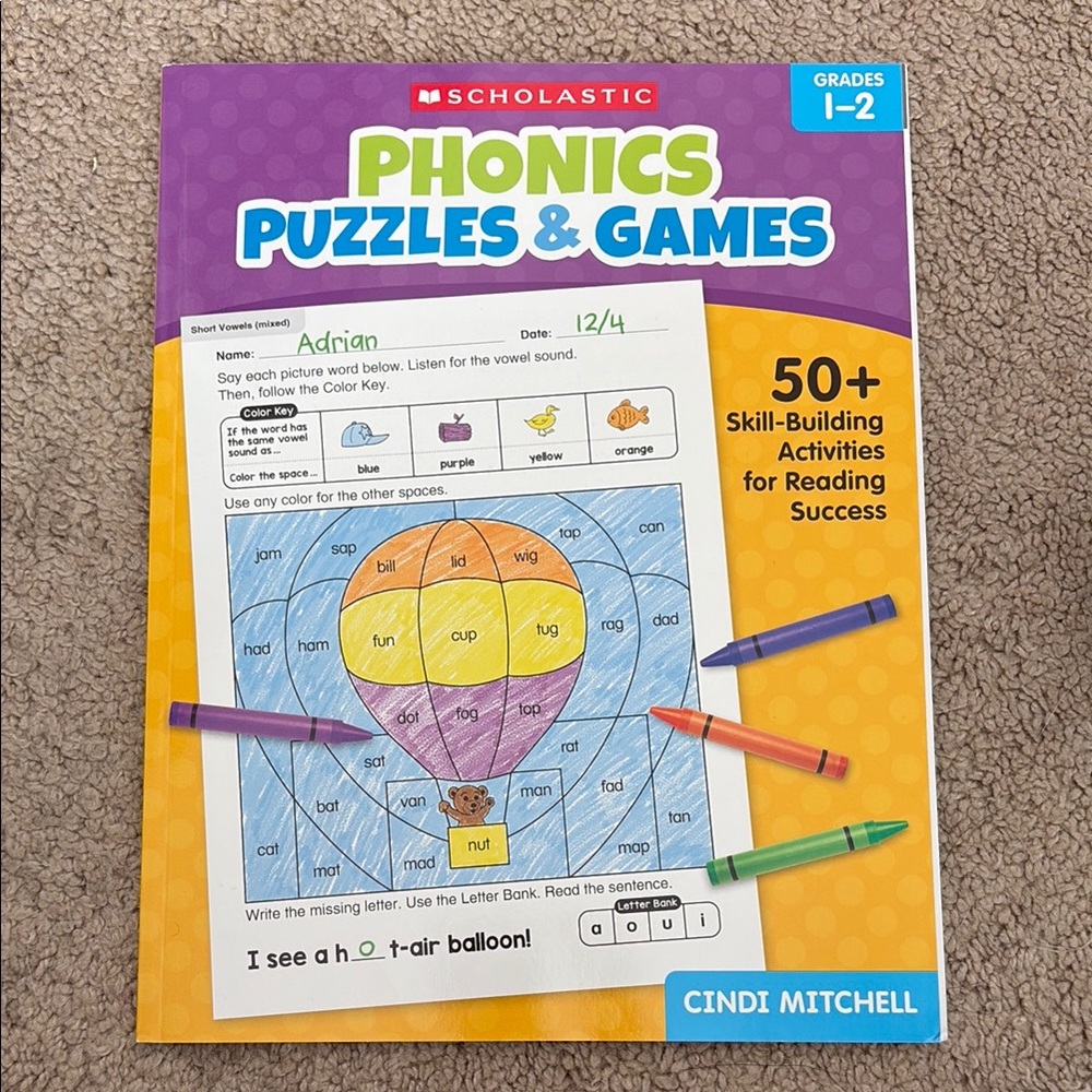 Scholastic Yellow and Purple Activity Book with Puzzles and Games